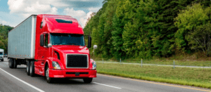 A Tractor Trailer cruises on down the highway