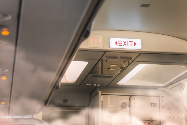 an exit sign on an airplane