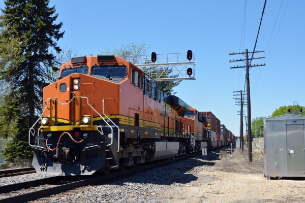 A train riding down the tracks. 